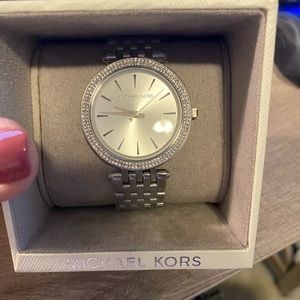 Brand new Michael Kors watch. Tags still on. Perfect gift for others or you!